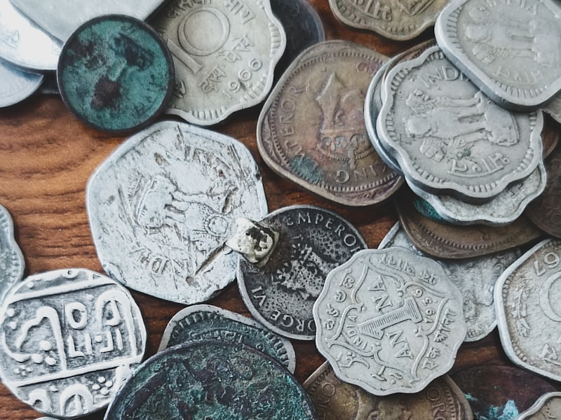 Editorial light table at the Ismailia atlas office with coin under loupe